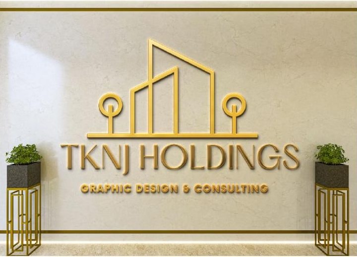 TKNJ Holdings gold logo on a wall